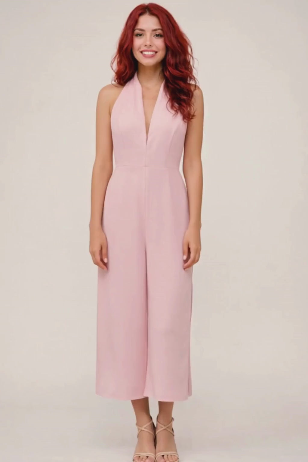 Video walkthrough of the halter jumpsuit construction, focusing on fabric movement, neckline pleats, and zipper finish.